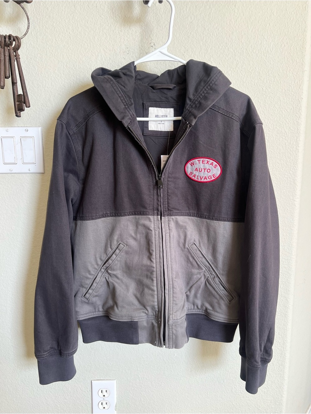 Hollister men’s Two-Tone Hooded Jacket in Black and Gray with Patch